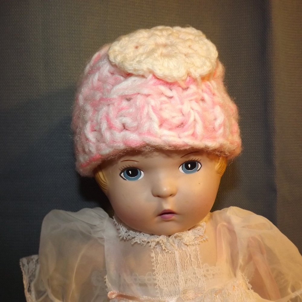 Hand Crafted knitted pink baby hat with cream flower newborn size